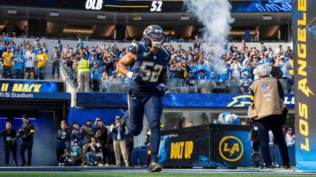 Khalil Mack runs into the field before an NFL football game.