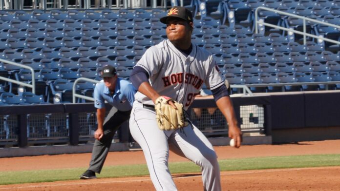 Framber Valdez in action during a baseball match.