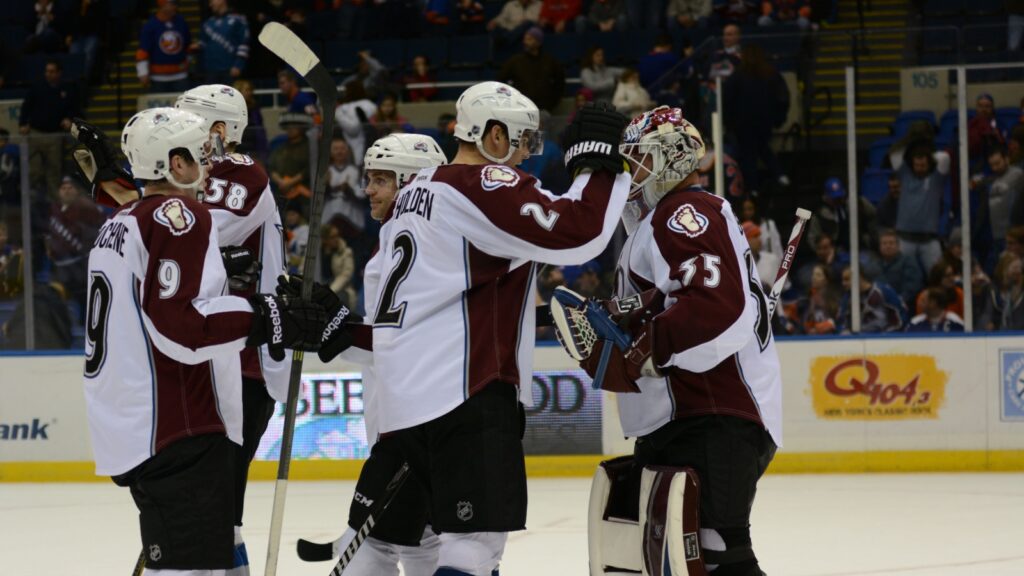 Colorado Avalanche players celebrate after winning the match.
