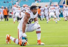 Browns reach decision on Myles Garrett following contract restructure reports Myles Garrett of Cleveland Browns sitting on one knee in the football ground.