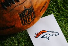 Broncos complete a stunning comeback against the Rams with a 30-26 win Denver Broncos NFL team logo and American football ball on green grass.