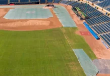 Rangers address bullpen needs with Jalen Beeks on one-year $1.6 million deal Aerial drone view overlooking the third base side of Durham Bulls Athletic Park The shot shows the green outfield grass transitioning to the dirt infield which is partially protected by large green tarps near the bases and pitchers mound