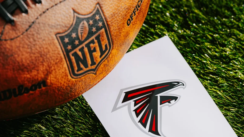 Atlanta Falcons logo and NFL official-size football
