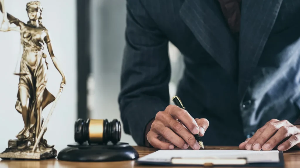 Attorneys sign legal documents in office