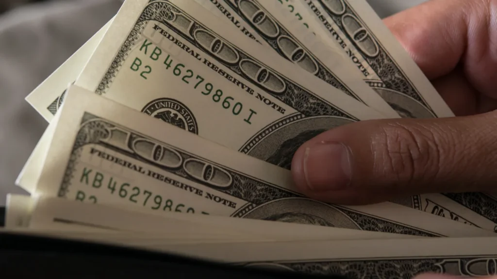 Billie dollar in hand