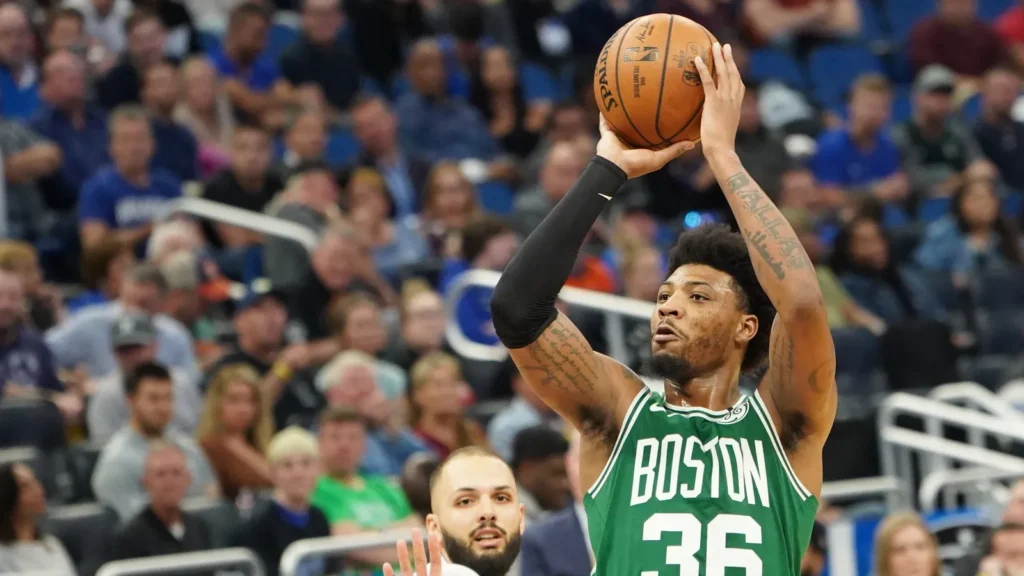 Marcus Smart shoots a three point