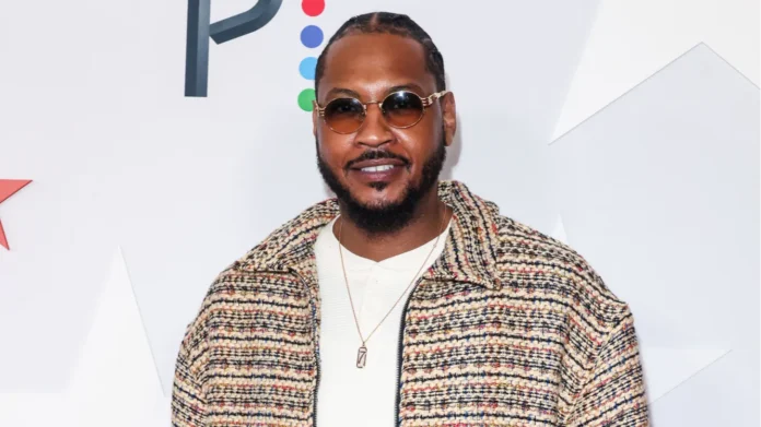 carmelo anthony arrives at the los angeles clippers and comcast Carmelo Anthony posing for the camera at the Los Angeles clippers and comcast event.