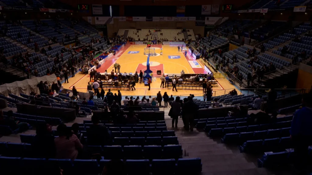 Full basketball hall on a league game night in Santiago