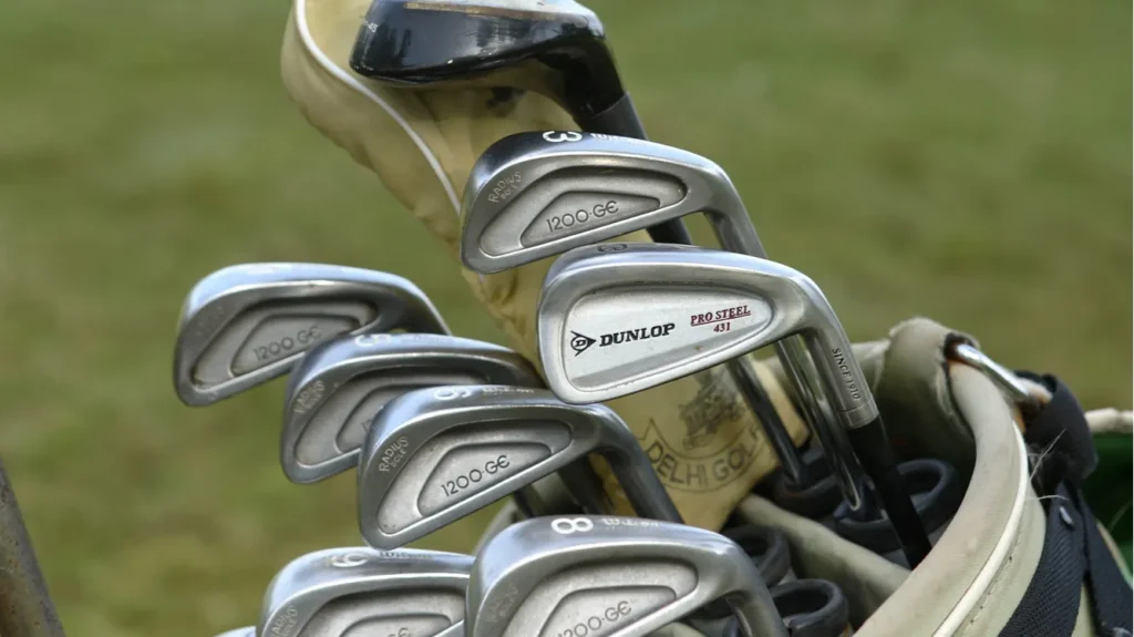 golf clubs in bag on green grass