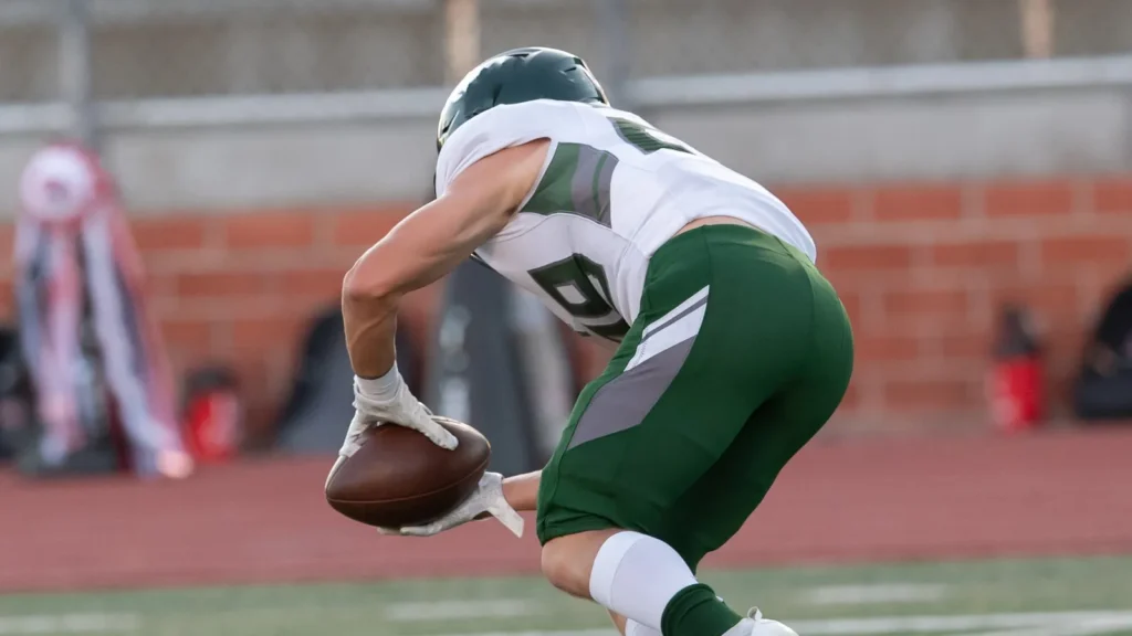 Great action photos of football players making amazing plays during a football game