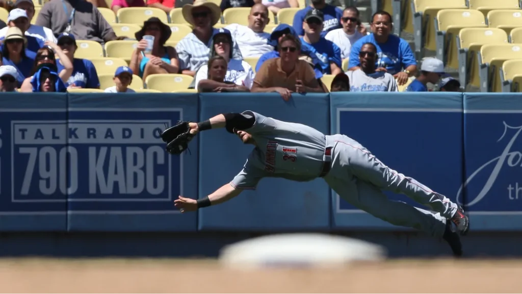 JONNY GOMES makes a diving catch during the game