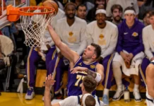 Luka Doncic to miss rest of regular season with hamstring injury setback Luka Doncic dunking during a basketball game.