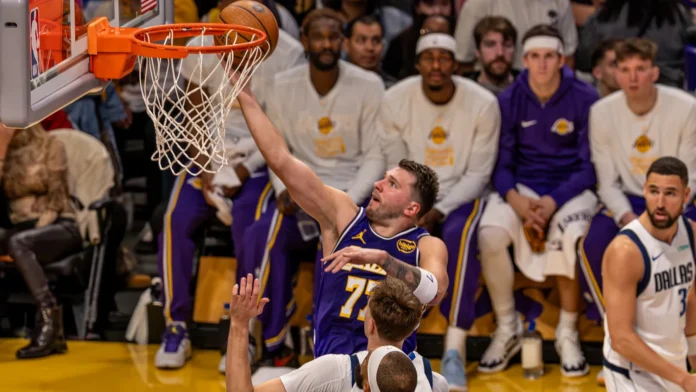 Luka Doncic dunking during a basketball game