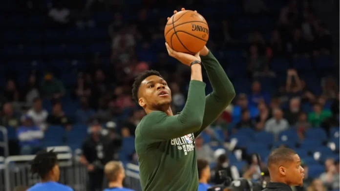 Giannis Antetokounmpo warms up