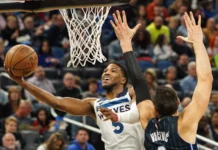 Minnesota Timberwolves Anthony Edwards aiming for the net.