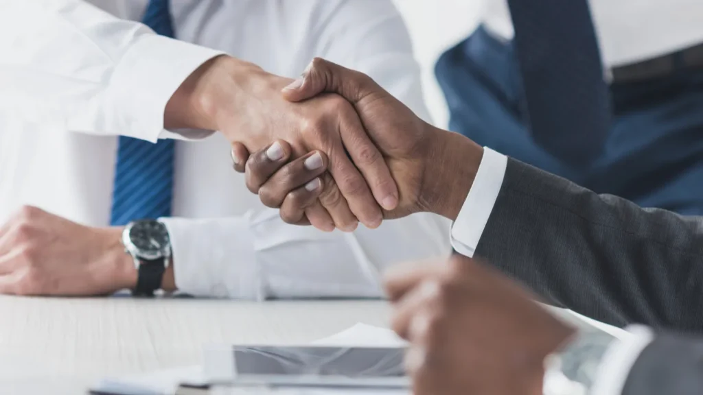 multicultural businessmen handshake