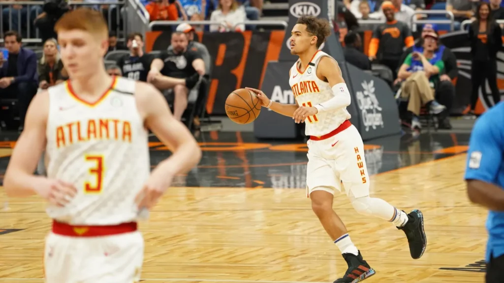 Atlanta Hawks players playing basketball in the court.
