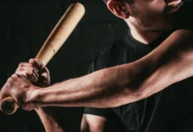 Mets agree to minor league contract with veteran outfielder Tommy Pham partial view of young sportsman playing baseball with bat isolated on black