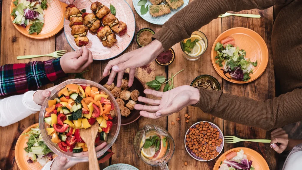 people having dinner at the rustic table