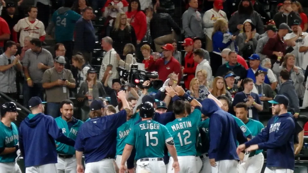Players of home team Mariners celebrating winning game at home