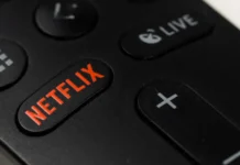 Everything we know about the massive new baseball project coming to Netflix Russia Novosibirsk 10112021 Closeup of a black remote control with a netflix button on a white table