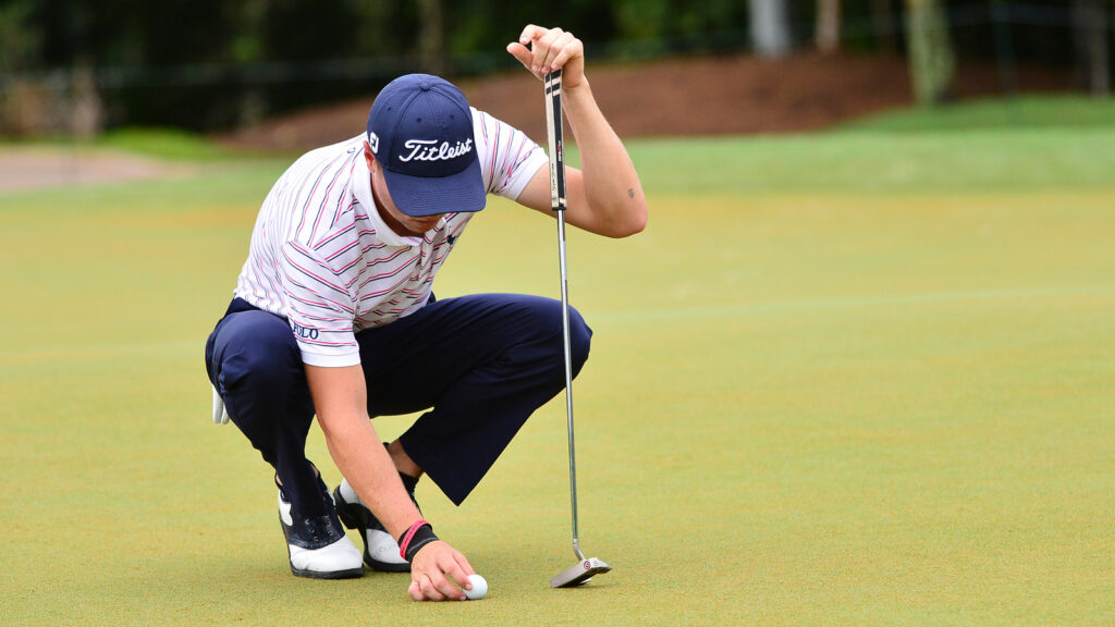 Justin Thomas line up the ball at 3rd holes