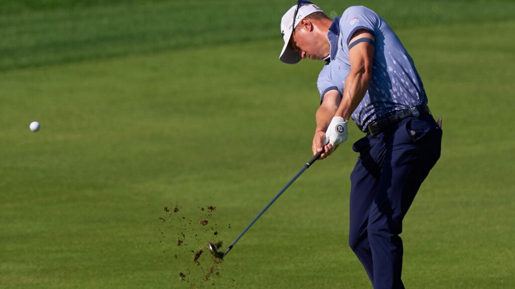Justin Thomas hitting a shot