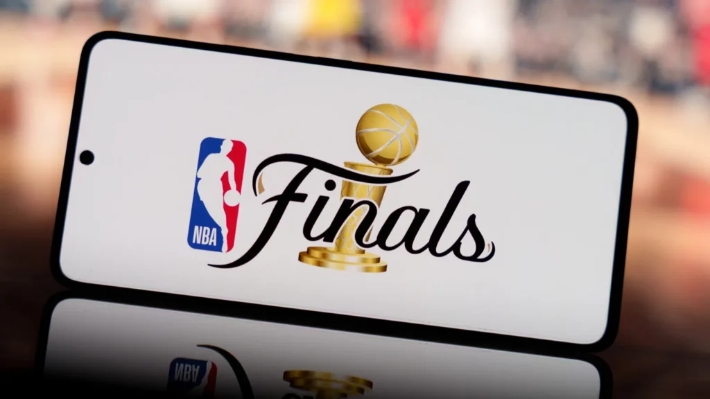 smartphone displaying nba finals logo with a blurred basketball court