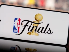 smartphone displaying nba finals logo with a blurred basketball court