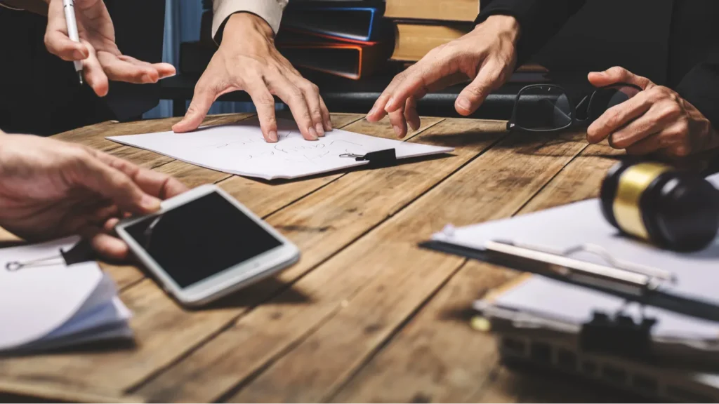 Teamwork of business lawyer meeting working hard about legal reg