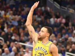 Stephen Curry lifts his hand during a basketball game