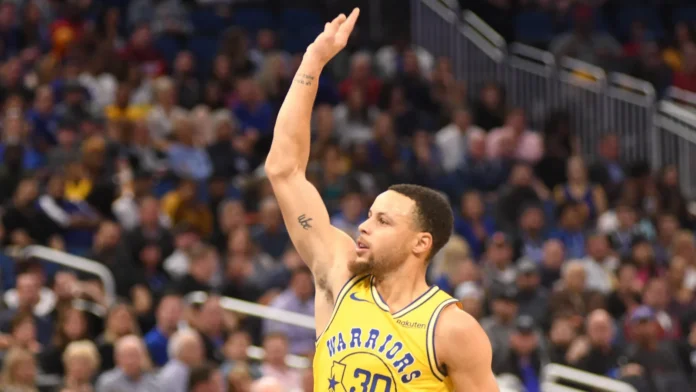 Stephen Curry lifts his hand during a basketball game