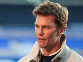 Tom Brady’s flag football project faces dispute over funding and relocation changes Tom Brady is interviewed prior to the Sky Bet League match