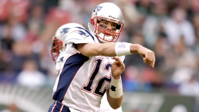 Tom Brady Quarterback for the New England Patriots in game action during the NFL seasons.