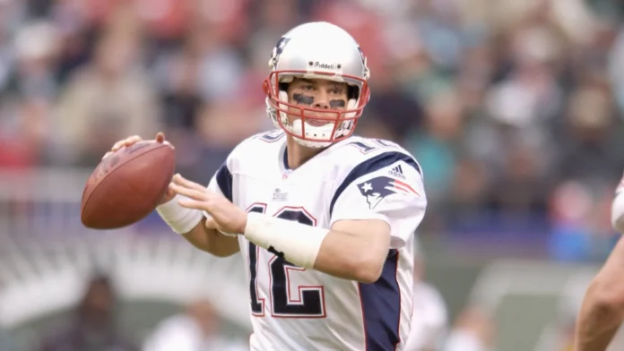 Tom Brady Quarterback for the New England Patriots in game action during the NFL season Tom Brady is an NFL football quarterback for the New England Patriots of the National Football League