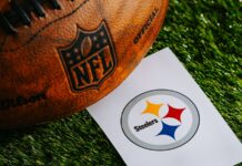 Pittsburgh Steelers address Aaron Rodgers’ comments about Dr. Anthony Fauci Pittsburgh Steelers NFL team Logo and American football ball on green grass.