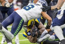 Coby Bryant reacts to Seahawks departure after signing with Bears Seattle Seahawks cornerback, Coby Bryant (8), dives over Los Angeles Rams running back, Kyren Williams (23), during an NFL football game.