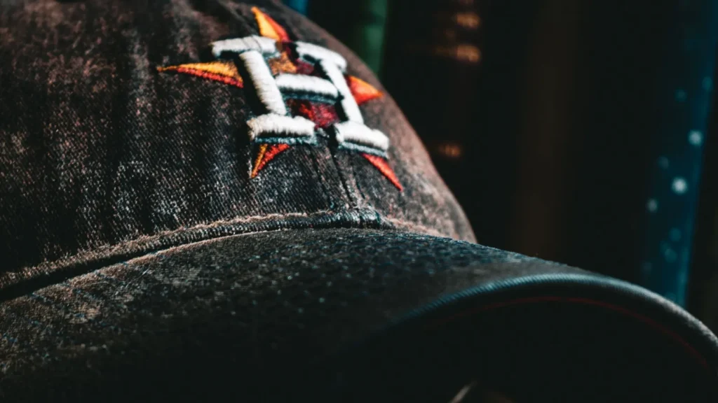 A Cinematic Photo of a Houston Astros Baseball Cap in front of Vintage Books