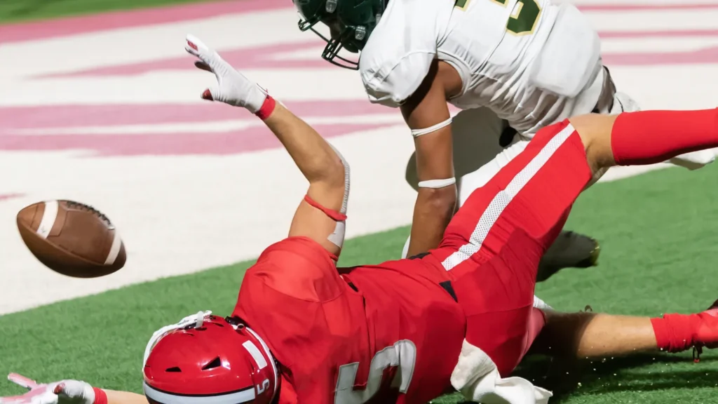 Amazing athletes making great catches and runs during a competitive football game