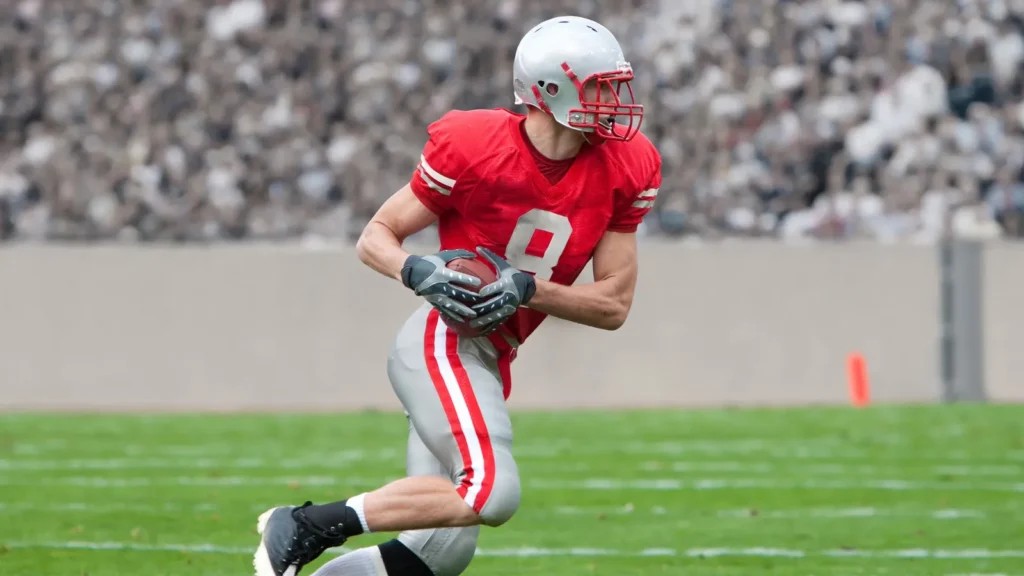American Football Player running upfield