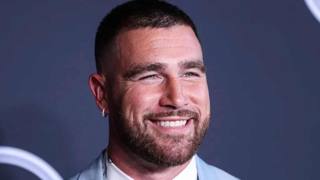 Travis Kelce smiling at an event.