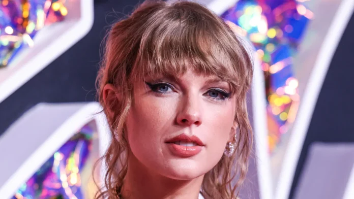 Taylor Swift looking into the camera at an event.