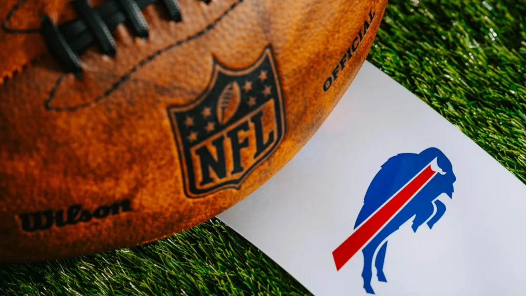 Buffalo Bills NFL team Logo and American football ball on Green Grass