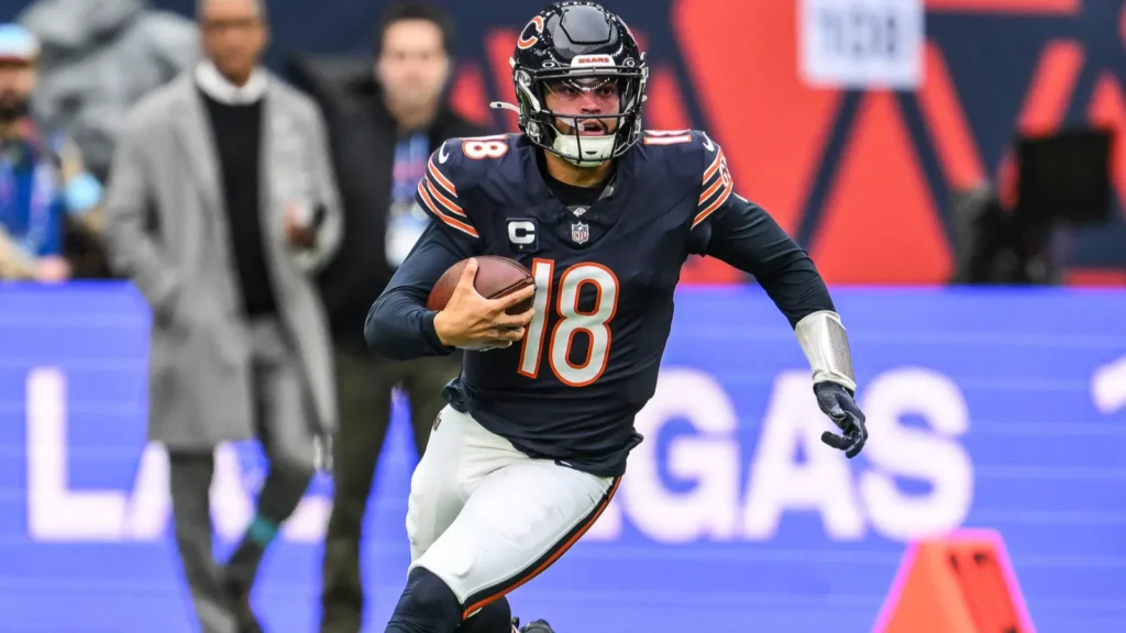 Caleb Williams of the Chicago Bears makes a run down field for a first down during the Week 6 match Chicago Bears vs Jacksonville Jaguars at Tottenham Hotspur Stadium London United Kingdom 13th October 2024