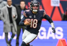 Caleb Williams of the Chicago Bears makes a run down