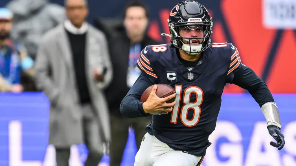 Caleb Williams of the Chicago Bears makes a run down
