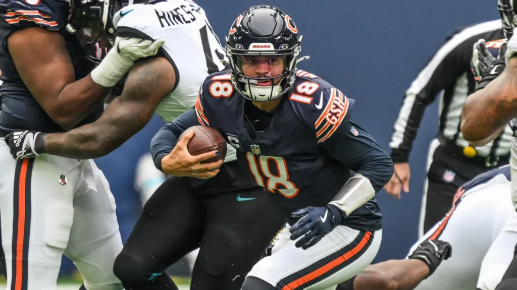 Caleb Williams of the Chicago Bears scrambles in the pocket during the Week 6 match Chicago Bears vs Jacksonville Jaguars at Tottenham Hotspur Stadium London United Kingdom 13th October 2024