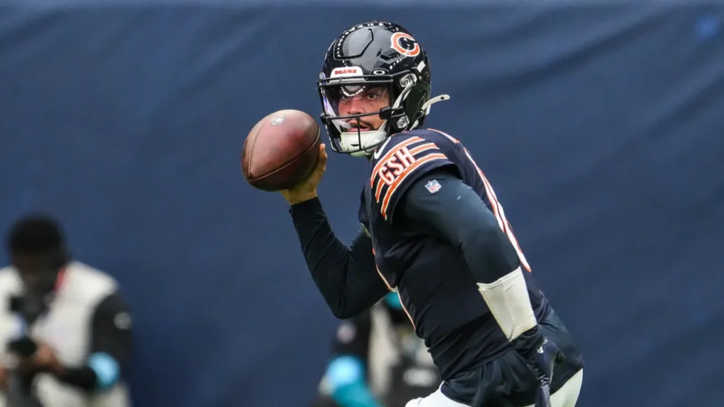 Caleb Williams of the Chicago Bears scrambles out of the pocket during the game.