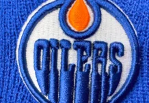 The surprising reason the Edmonton Oilers feel great about their game despite missing two elite scorers Calgary Alberta Canada Apr 10 2025 A closeup shows the embroidered Edmonton Oilers logo on a blue knit fabric The logo features