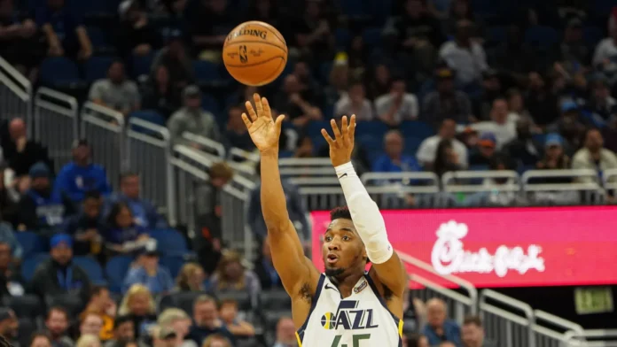 Donovan Mitchell 45 shoots a three point Amway Center in Orlando on Friday January 4 2020 Photo Credit Marty JeanLouis
